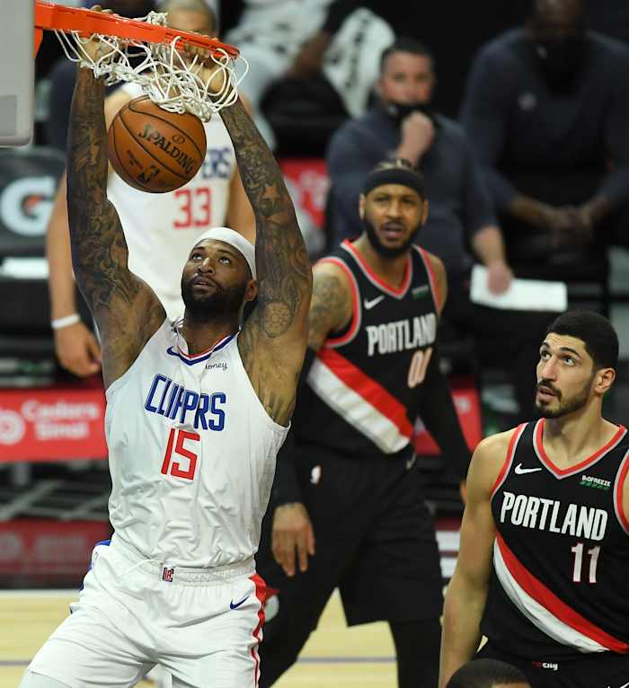 Apr 6, 2021; Los Angeles, California, USA; Portland Trail Blazers forward Carmelo Anthony (00) and center Enes Kanter (11) look on as Los Angeles Clippers center DeMarcus Cousins (15) goes up for a dunk in the first half of the game at Staples Center. Mandatory Credit: Jayne Kamin-Oncea-USA TODAY Sports
